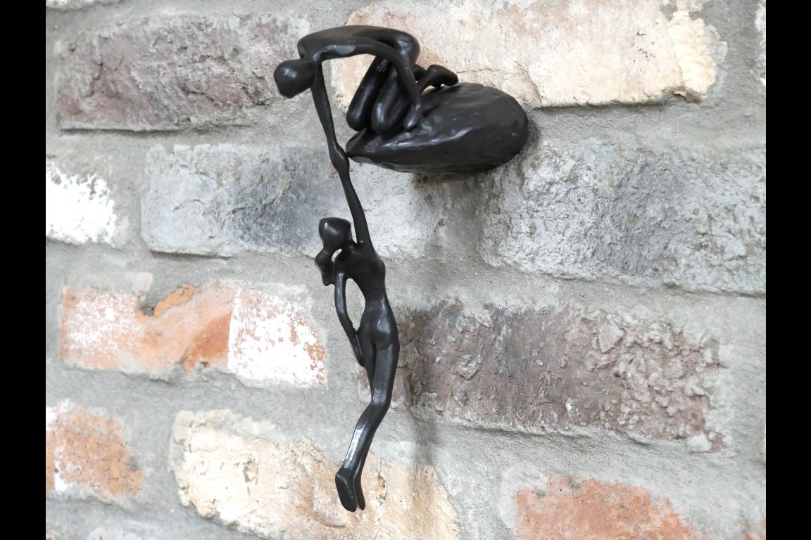 Man Lifting Wall Decoration