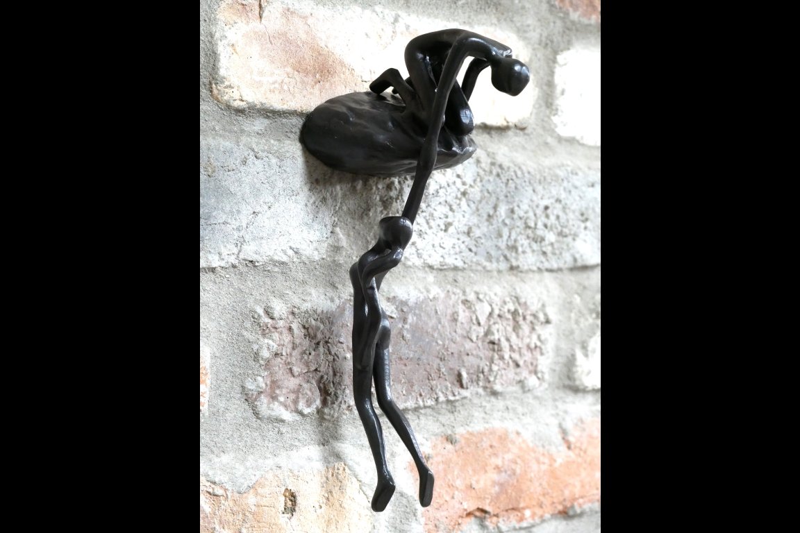 Man Lifting Wall Decoration