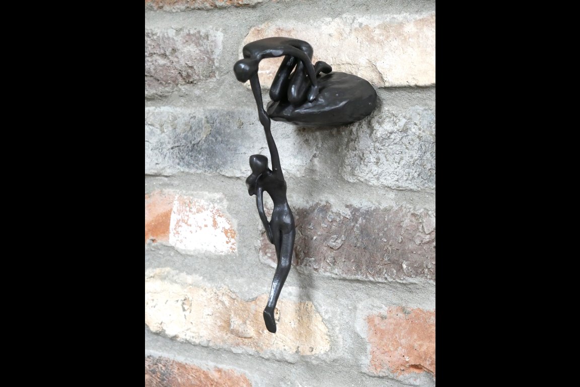 Man Lifting Wall Decoration
