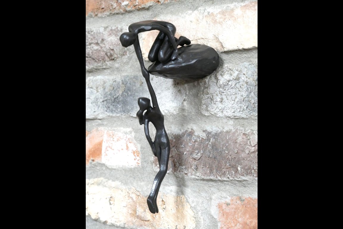 Man Lifting Wall Decoration