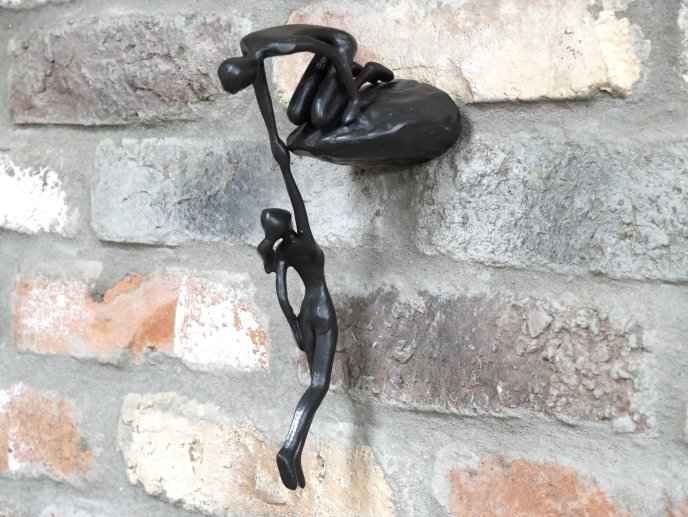 Man Lifting Wall Decoration
