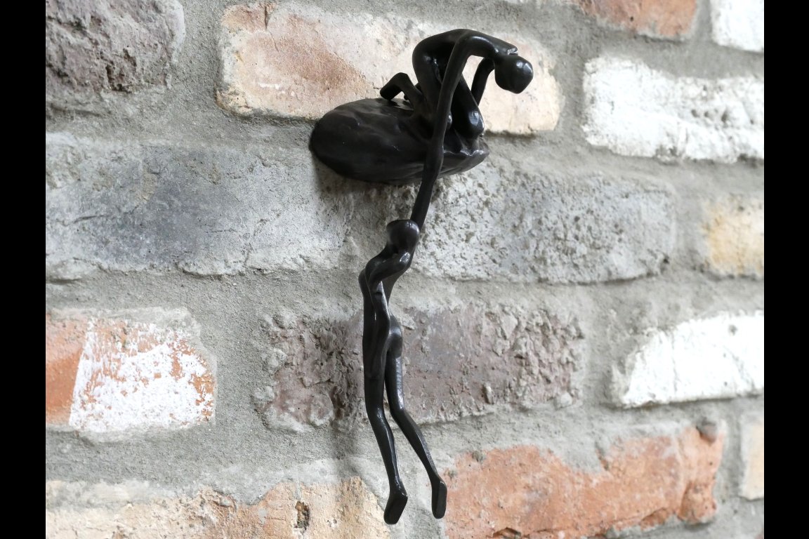 Man Lifting Wall Decoration