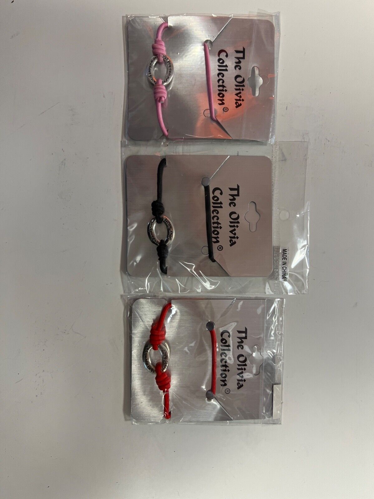 THE OLIVIA COLLECTION BRACELET LOVE IS .BOOTLACE RED PINK BLACK PARTY BAGS