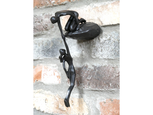 Man Lifting Wall Decoration