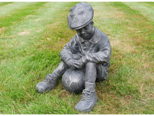 Boy Sat With Football