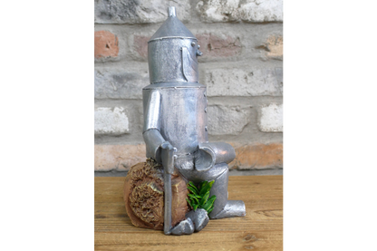 Tin Man Sat On A Log