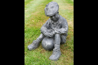 Boy Sat With Football