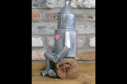 Tin Man Sat On A Log