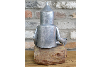 Tin Man Sat On A Log