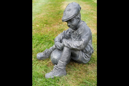 Boy Sat With Football
