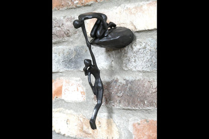 Man Lifting Wall Decoration