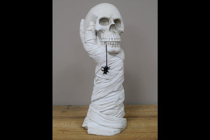 Hand Holding Skull