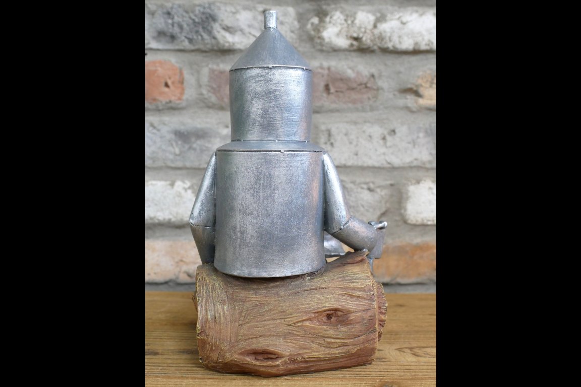 Tin Man Sat On A Log