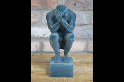 Man With Head In Hands