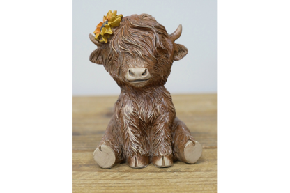 Sitting Highland Cow
