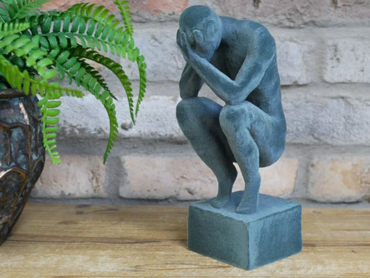 Man With Head In Hands