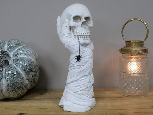 Hand Holding Skull