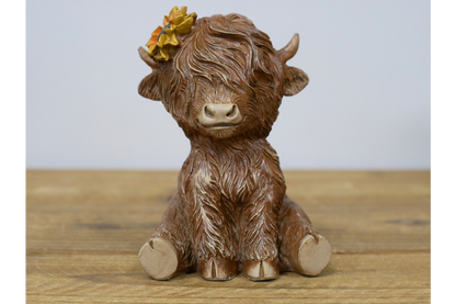 Sitting Highland Cow