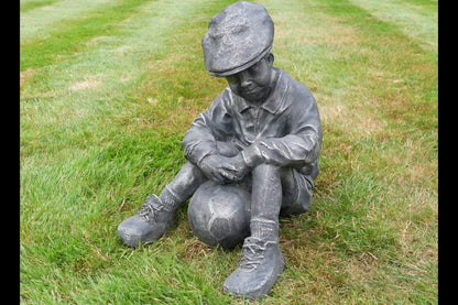 Boy Sat With Football