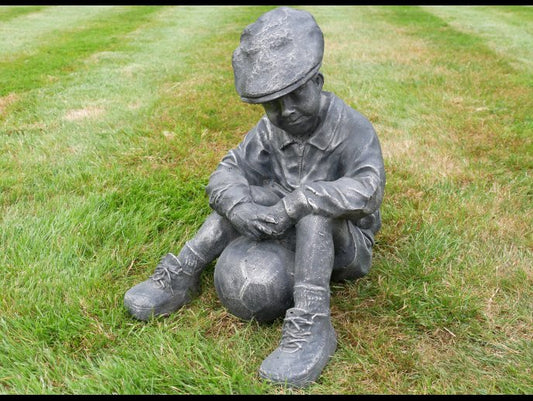 Boy Sat With Football