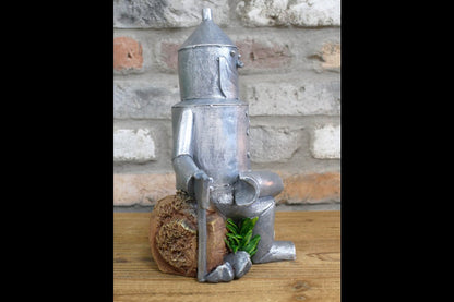 Tin Man Sat On A Log